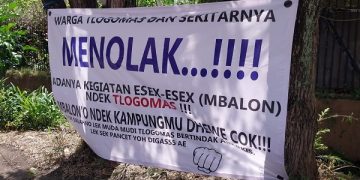 Salah satu spanduk bertuliskan protes keras adanya prostitusi di hotel wilayah Tlogomas. Foto: Bacaini/A.Ulul