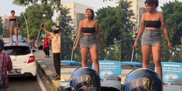 Viral! Aksi Perempuan Seksi Teriak Gudang Garam Jaya di Atas Kap Mobil. (foto tangkapan layar akun Tik Tok @l.elisabeths)