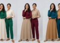 wanita dengan kulit sawo matang mengenakan outfit emerald dan cream