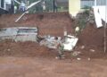 Plengsengan dan pagar Kantor Desa Sobo di Munjungan, Trenggalek, yang longsor setelah hujan